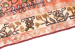 Backside of handmade 1976s Hamedan rug showing knot structure and weave density