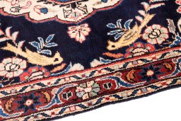 Backside of handmade 1984s Hamedan rug showing knot structure and weave density