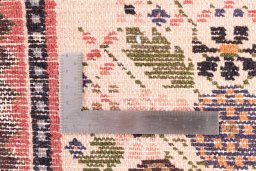 Corner detail of 2002s Hamedan rug showing border pattern and Wool pile