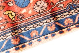 Backside of handmade 1975s Hamedan rug showing knot structure and weave density