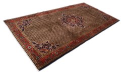 Corner detail of 2000s Hamedan rug showing border pattern and Wool pile