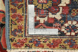 Corner detail of 1930s Heriz rug showing border pattern and Wool pile