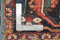 Full view of 1940s Heriz rug from Iran / Persia, 374 × 275 cm in Dark red tones