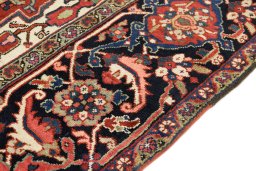 Backside of handmade 1940s Heriz rug showing knot structure and weave density