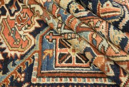 Full view of 1920s Heriz rug from Iran / Persia, 367 × 278 cm in Red tones