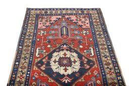 Surface texture of 1920s Heriz rug with natural Wool and intricate pattern