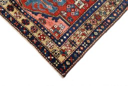 Backside of handmade 1920s Heriz rug showing knot structure and weave density
