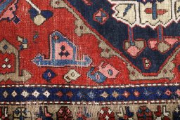 Close-up detail of 1920s Heriz rug from Iran / Persia showing Wool weave