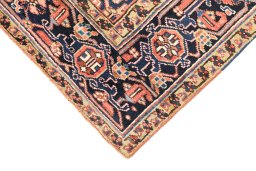 Backside of handmade 1920s Heriz rug showing knot structure and weave density