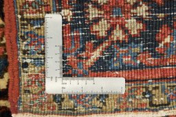 Corner detail of 1920s Heriz rug showing border pattern and Wool pile