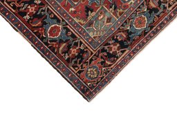 Backside of handmade 1940s Heriz rug showing knot structure and weave density