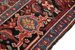 Close-up detail of 1940s Heriz rug from Iran / Persia showing Wool weave