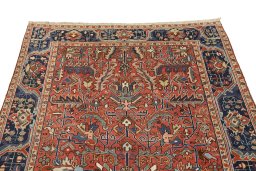 Backside of handmade 1920s Heriz rug showing knot structure and weave density