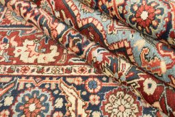 Full view of 1920s Heriz rug from Iran / Persia, 275 × 188 cm in Dark red tones