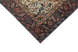 Backside of handmade 1920s Heriz rug showing knot structure and weave density
