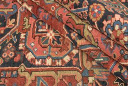 Corner detail of 1930s Heriz rug showing border pattern and Wool pile