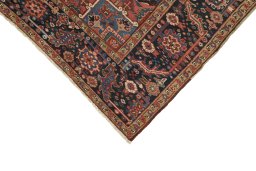 Backside of handmade 1930s Heriz rug showing knot structure and weave density