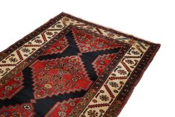 Close-up detail of 1880s Heriz rug from Iran / Persia showing Wool weave