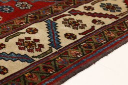 Backside of handmade 1880s Heriz rug showing knot structure and weave density