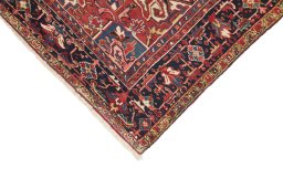 Backside of handmade 1940s Heriz rug showing knot structure and weave density