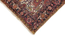 Backside of handmade 1940s Heriz rug showing knot structure and weave density