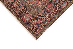 Backside of handmade 1940s Heriz rug showing knot structure and weave density