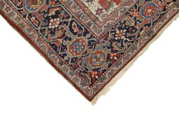 Backside of handmade 1920s Heriz rug showing knot structure and weave density