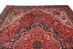 Surface texture of 1940s Heriz rug with natural Wool and intricate pattern