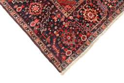 Backside of handmade 1940s Heriz rug showing knot structure and weave density