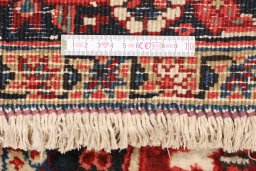 Full view of 1940s Heriz rug from Iran / Persia, 467 × 336 cm in Dark red tones