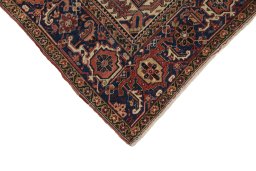 Backside of handmade 1940s Heriz rug showing knot structure and weave density