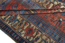 Corner detail of 1930s Heriz rug showing border pattern and Wool pile