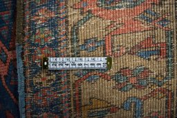 Surface texture of 1930s Heriz rug with natural Wool and intricate pattern