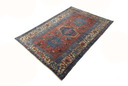 Corner detail of 1930s Heriz rug showing border pattern and Wool pile