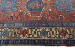 Full view of 1930s Heriz rug from Iran / Persia, 219 × 151 cm in Red tones