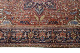 Corner detail of 1930s Heriz rug showing border pattern and Wool pile