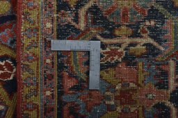Backside of handmade 1930s Heriz rug showing knot structure and weave density