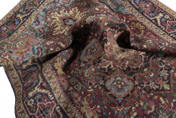 Surface texture of 1930s Heriz rug with natural Wool and intricate pattern