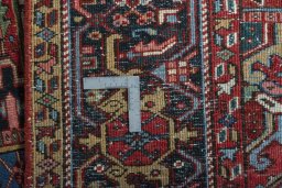 Full view of 1930s Heriz rug from Iran / Persia, 365 × 275 cm in Red tones