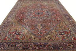 Surface texture of 1930s Heriz rug with natural Wool and intricate pattern