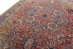 Backside of handmade 1930s Heriz rug showing knot structure and weave density