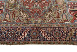 Full view of 1930s Heriz rug from Iran / Persia, 438 × 310 cm in Red tones