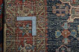 Close-up detail of 1930s Heriz rug from Iran / Persia showing Wool weave