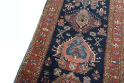 Backside of handmade 1930s Heriz rug showing knot structure and weave density
