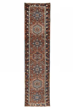 Full view of 1930s Heriz rug from Iran / Persia, 319 × 81 cm in Red tones