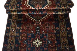 Corner detail of 1930s Heriz rug showing border pattern and Wool pile