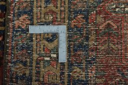 Surface texture of 1930s Heriz rug with natural Wool and intricate pattern