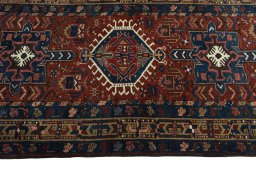 Full view of 1930s Heriz rug from Iran / Persia, 450 × 100 cm in Red tones