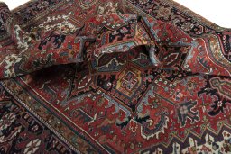 Surface texture of 1930s Heriz rug with natural Wool and intricate pattern