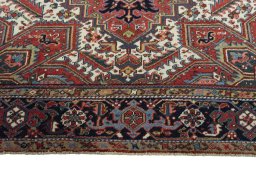 Full view of 1930s Heriz rug from Iran / Persia, 347 × 255 cm in Red tones